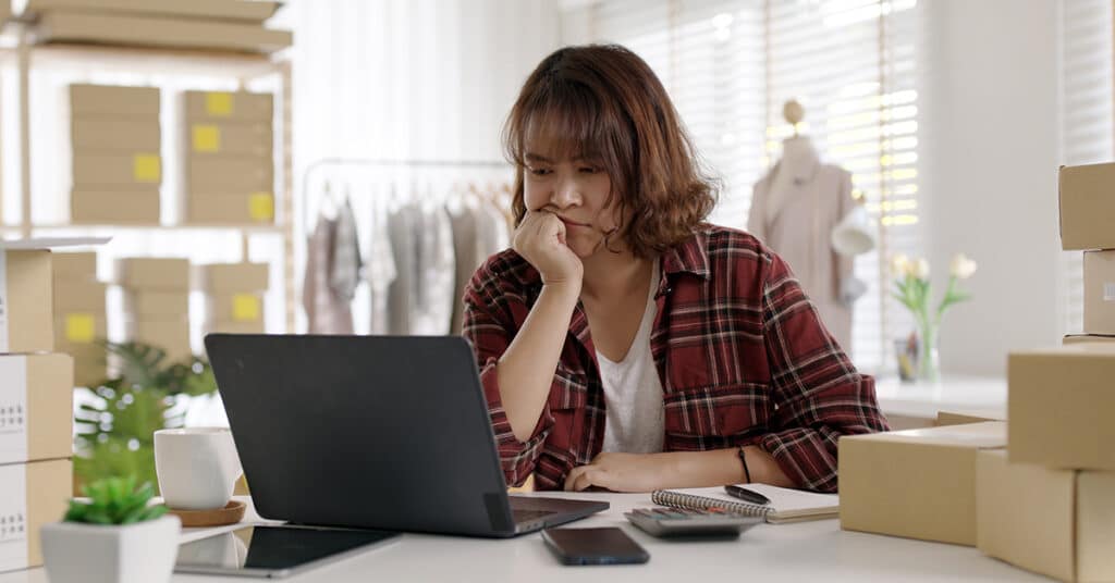 7 Most Costly Accounting Mistakes Small Business Make. Photo of stressed woman business owner on laptop