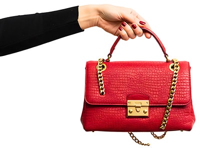 7 Most Costly Accounting Mistakes Small Business Make. Photo of woman's purse. Don't mix personal and business money.